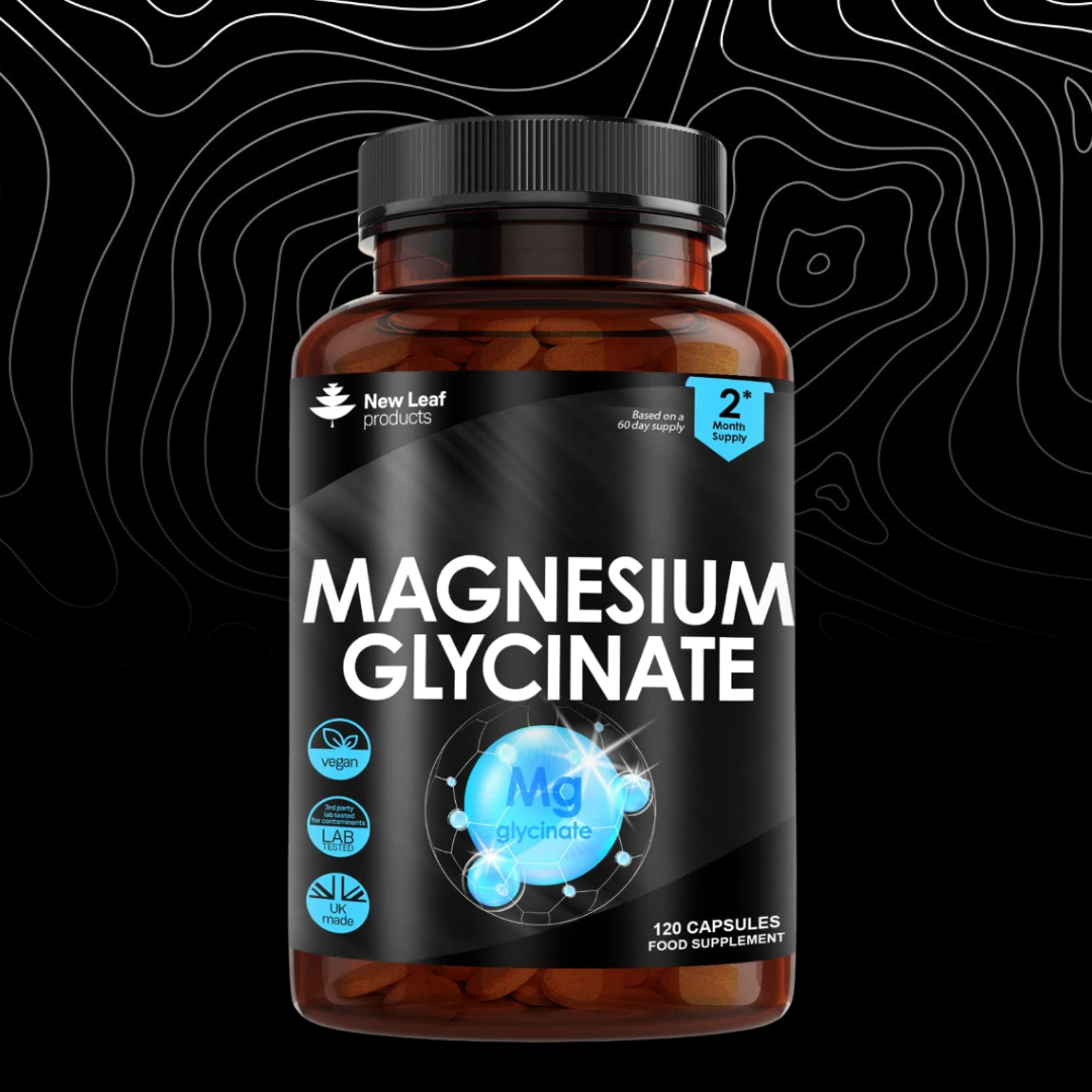 Bottle of magnesium glycinate capsules on a black background