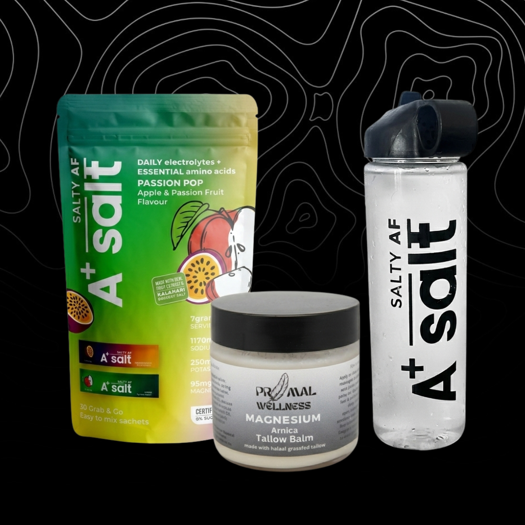 Collection of Salty AF products including a green packet, a jar, and a water bottle on a black background.