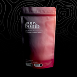 Body Bomb package on a black background with white abstract patterns