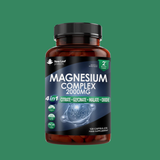 Bottle of magnesium complex supplement on a green background