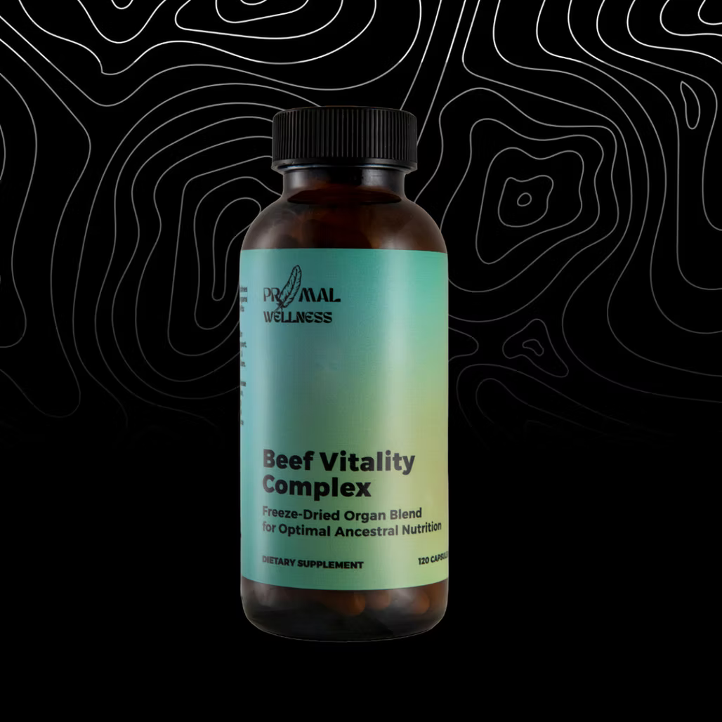 Bottle of Primal Wellness Beef Vitality Complex on a black background with white line art