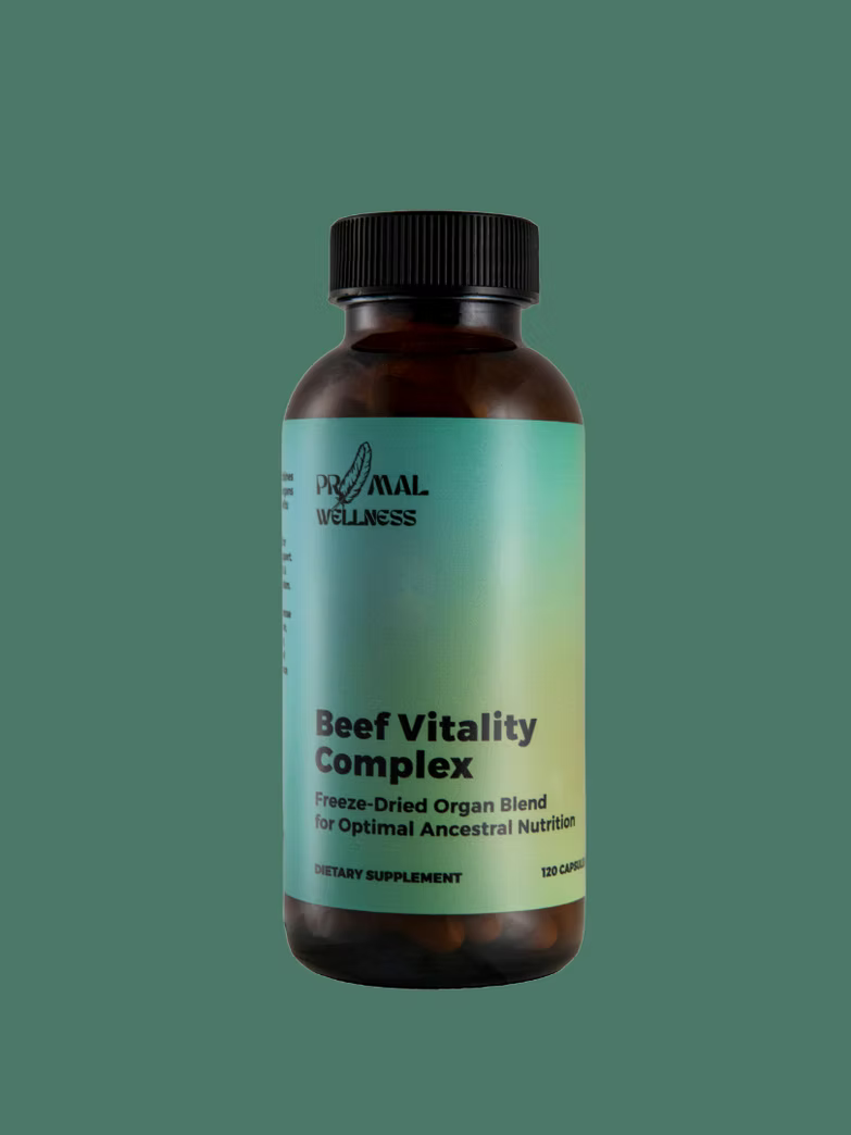 Supplement bottle labeled 'Beef Vitality Complex' by Primal Wellness on a gradient green background