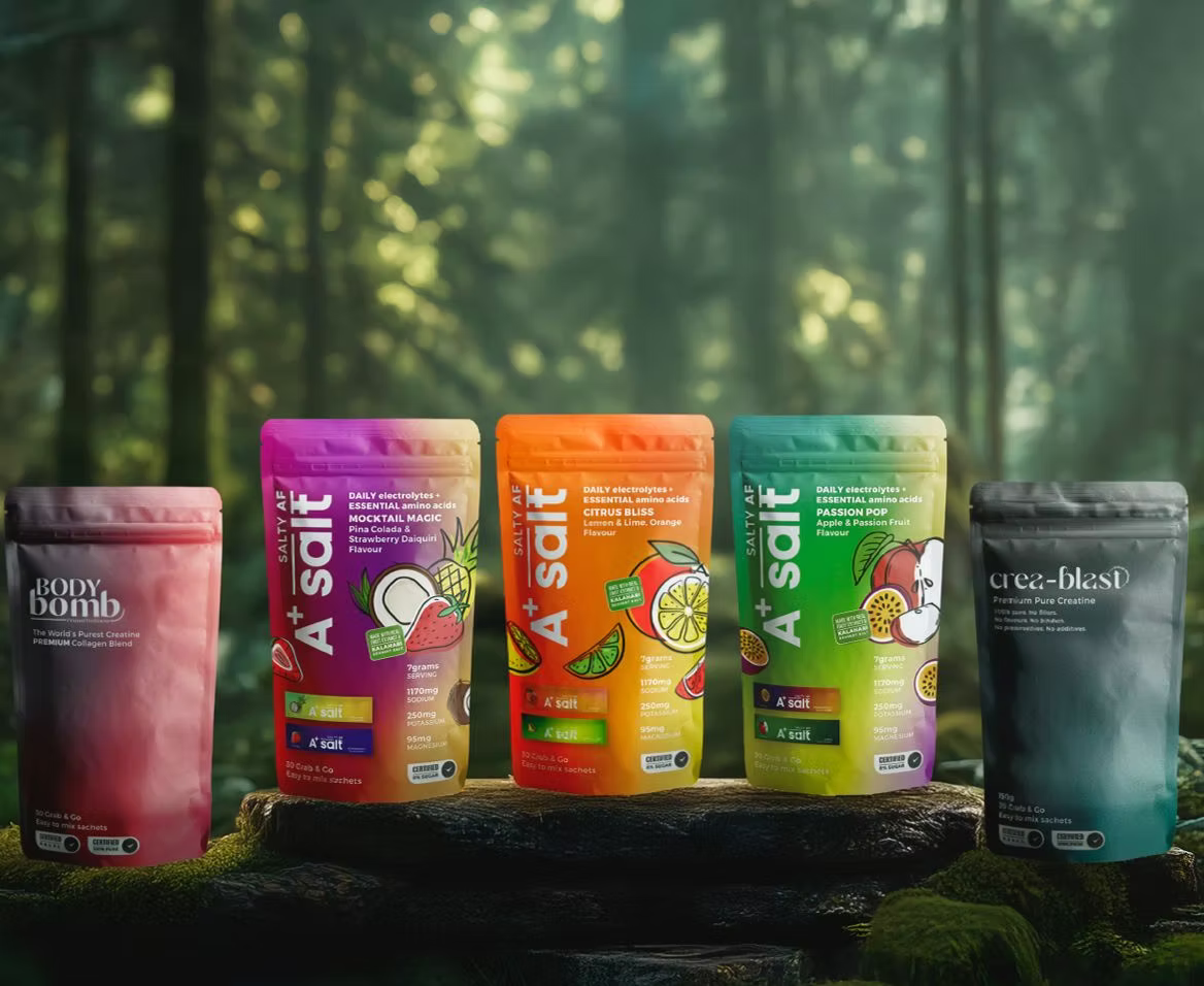 Assorted health and wellness product packaging on a natural background